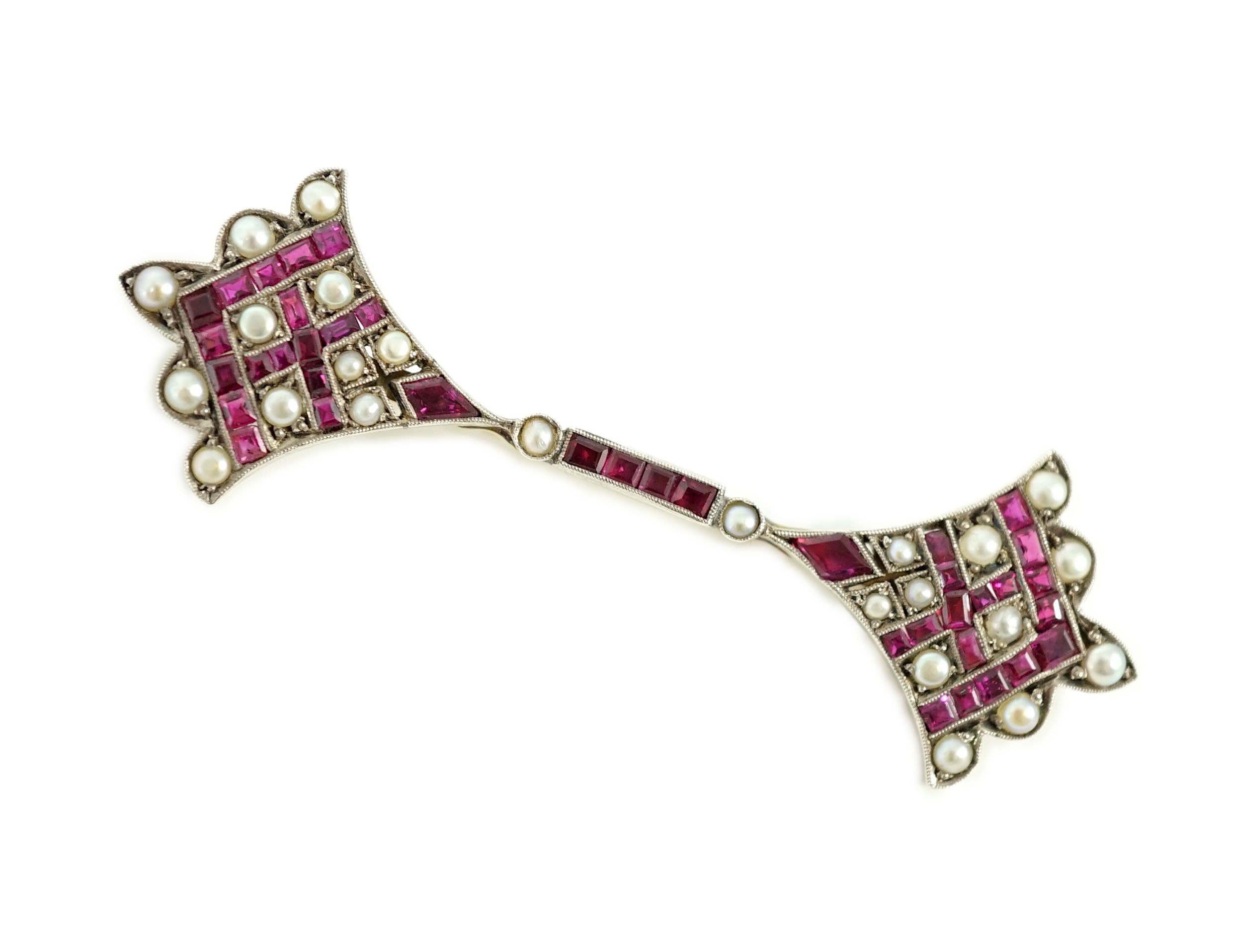 An early 20th century, gold, platinum, ruby and seed pearl set brooch